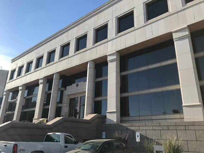 shutterstock_1405012190 Modern office building with columns and reflective windows