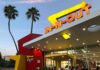 Sharpened Stick Terror—One Kid Steps Up In-N-Out Burger restaurant exterior at dusk