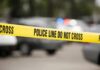 Torso In A Tote – Teen Bolts, Cops Move Yellow police line tape at a blurred street scene