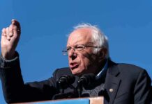 Washington’s $7T Grab – AI Shut Down? elderly man speaking at outdoor podium