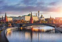 Peace Track Stalled – Leverage War Begins Kremlin complex by a river at sunset