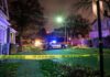 Sleeping Couple Ambushed – Why Him? Police car blocks residential street at night behind caution tape