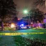 Sleeping Couple Ambushed – Why Him? Police car blocks residential street at night behind caution tape
