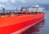 Red oil tanker ship at sea