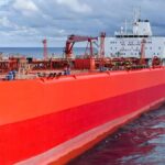 Red oil tanker ship at sea