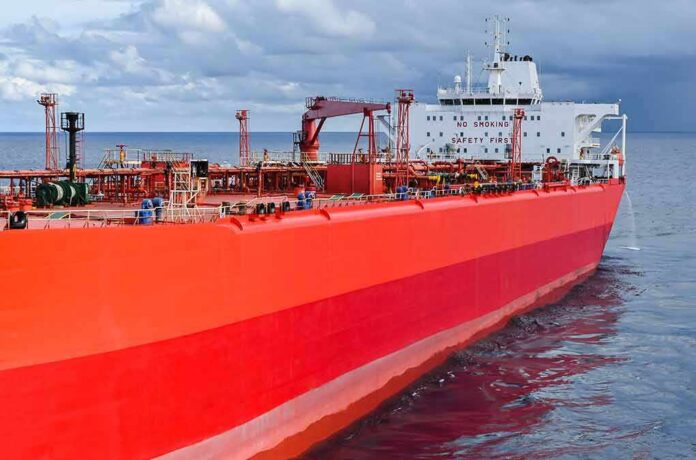 Red oil tanker ship at sea