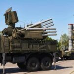 military air defense vehicles on a road