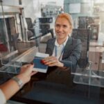 airport check-in agent handing back a passport
