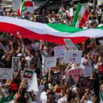 Celebrity Scandal, Vicious Penalty: 99 Lashes Protest crowd with flags and signs; Seyed Ebrahim Raisi, La Parka, Brian Robiskie, Philly Brown, Miguel Francisco Barragán Andrade present
