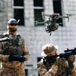 Smart Trigger Turns Grunts Into Drone Hunters Quadcopter drone flying above soldiers in camouflage