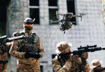 Smart Trigger Turns Grunts Into Drone Hunters Quadcopter drone flying above soldiers in camouflage