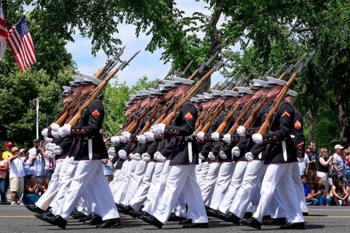 Ryan Hewitt and Bear Pascoe marching with a military honor guard in a parade