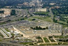 Aerial view of a large five-sided government building with surrounding highways