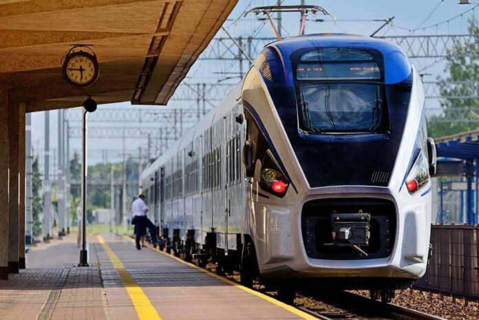 shutterstock_439991839 Modern passenger train arriving at a station platform