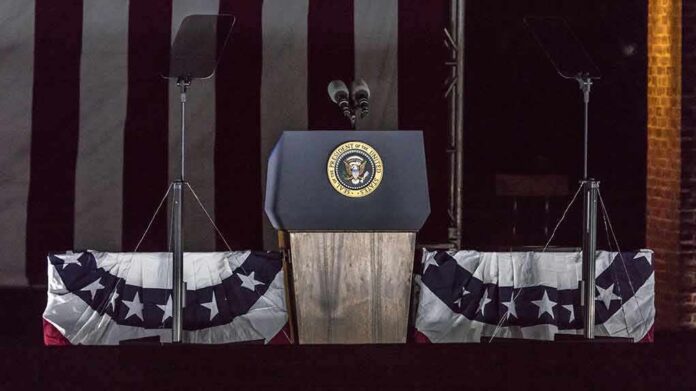 Presidential podium with microphones and teleprompters