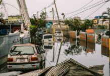 Jersey Shore DROWNS – State Emergency Flooded urban street with abandoned cars and downed power lines