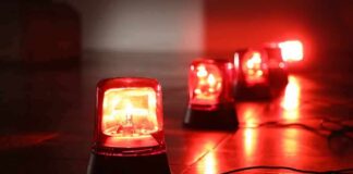 Red emergency beacons on a floor