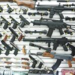 Wall display of assorted firearms in a gun shop