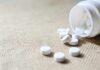 Parents Stunned: WHO OKs Teen Weight Drugs White tablets spilling from a plastic bottle