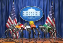 Trump Targets Media – Billion-Dollar Blitz Press microphones at a White House briefing podium
