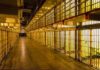 Tennessee Meltdown: Prison Chief Out Prison cell block corridor with barred cells and upper walkways