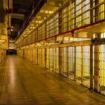 Tennessee Meltdown: Prison Chief Out Prison cell block corridor with barred cells and upper walkways