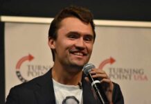 Campus Meltdown: Poem Praises Kirk Killing man speaking into a microphone on stage