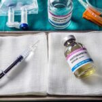 Medical tray with syringe and pentobarbital vials on gauze
