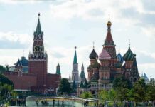 Saint Basil's Cathedral and Kremlin towers under a cloudy sky