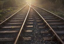 Controller’s Call Triggers Mass Casualties Railway tracks converging into the distance at sunset