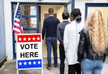 Subpoenas Loom: Who Orchestrated “Dan” Switch? Voters standing in line at a polling place entrance