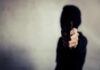 Gunpoint Ambush Rattles LA – Where’s Newsom? person in a hoodie pointing a handgun toward the camera