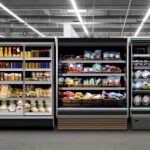 Supermarket refrigerated display cases with drinks, produce, and prepared foods