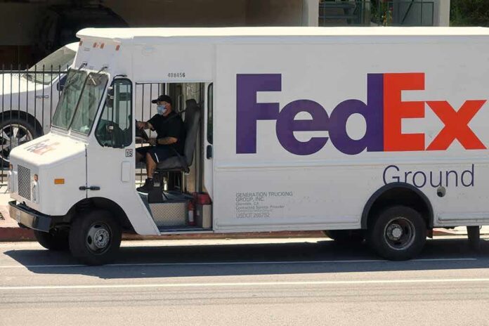 FedEx Ground delivery truck with driver wearing a mask