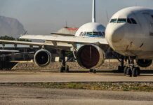 An Airport Attack Draws International Legal Scrutiny Parked passenger aircraft with covered engines on a tarmac
