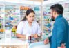 That Cold Remedy May Have a Hidden Catch Pharmacist advising customer at a pharmacy counter