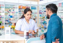 That Cold Remedy May Have a Hidden Catch Pharmacist advising customer at a pharmacy counter