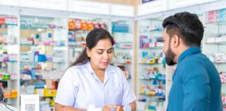 Pharmacist advising customer at a pharmacy counter