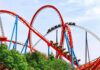Deadly Drop Triggers Urgent Ride Crackdown Colorful roller coaster with riders on a sunny day