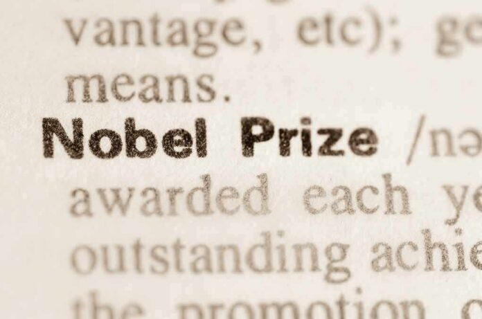 shutterstock_264333239 Nobel Prize text highlighted in a dictionary