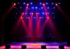 A Packed Arena Faces an Unexpected Scare stage with red and blue spotlights shining onto an empty floor