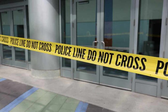 Yellow police tape blocking entrance to building