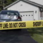 Bloody Scene, One Line – Case Explodes Sheriff line tape blocking a suburban driveway