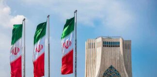 Iranian flags beside Azadi Tower in Tehran