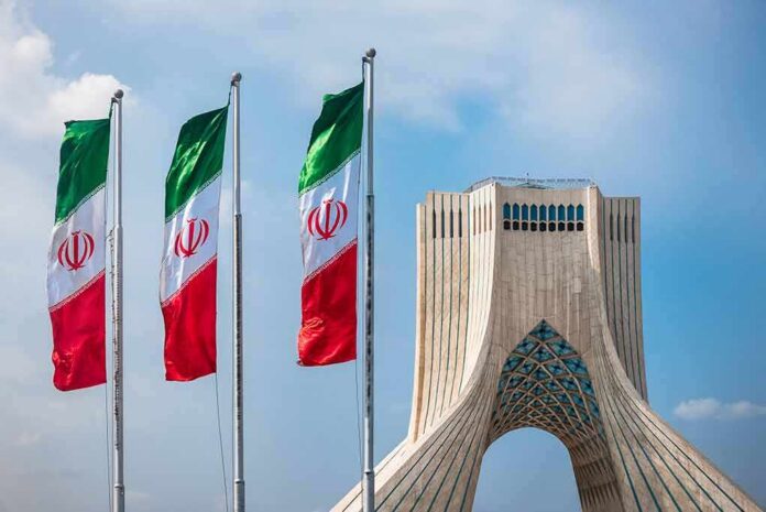 Iranian flags beside Azadi Tower in Tehran