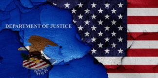 Flags of the US and Department of Justice, cracked background.