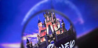 Disney castle logo under a magnifying glass.