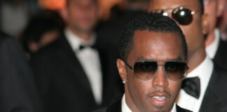 Sean Diddy, Man in suit and sunglasses at formal event