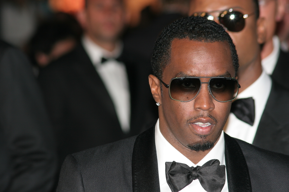 Sean Diddy, Man in suit and sunglasses at formal event