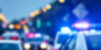 Police cars with flashing lights at a scene